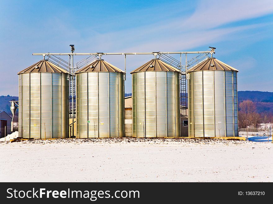 silo and snow white acre with blue sky. silo and snow white acre with blue sky