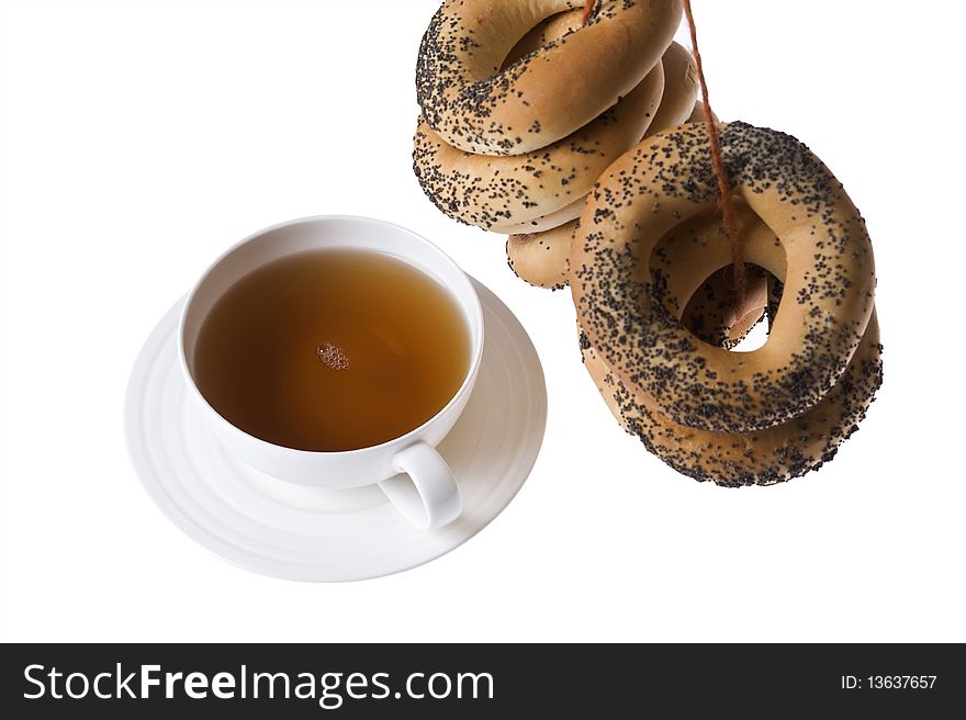 Cup of tea and bagels isolated on white background