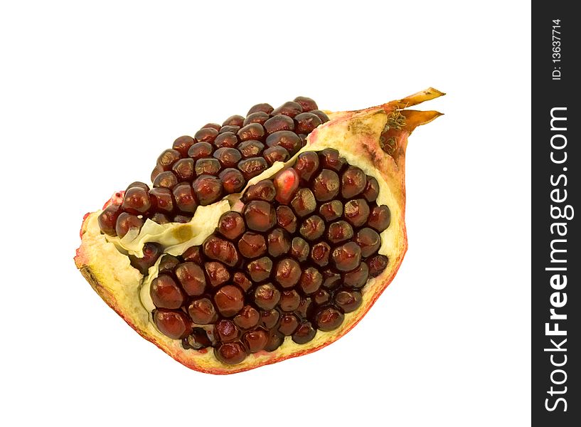 Piece of pomegranate with grains on white