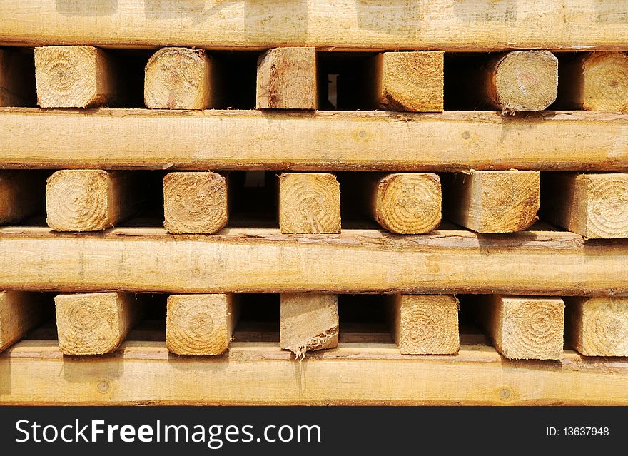 Square wood material piled up outside. Square wood material piled up outside.