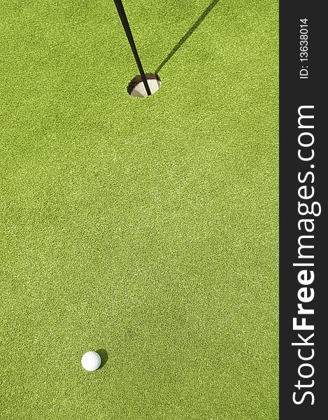 Golfing. Very nice composition of ball and the hole. Golfing. Very nice composition of ball and the hole.