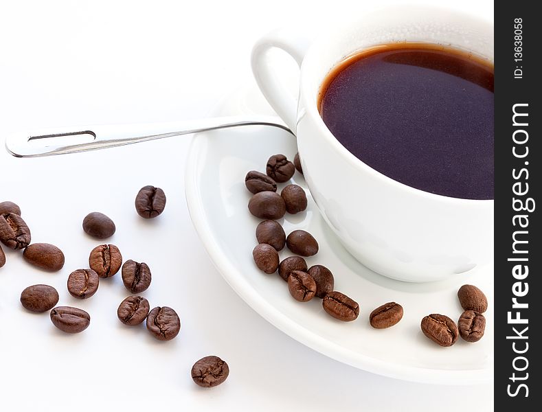 Coffee and coffee beans on white background