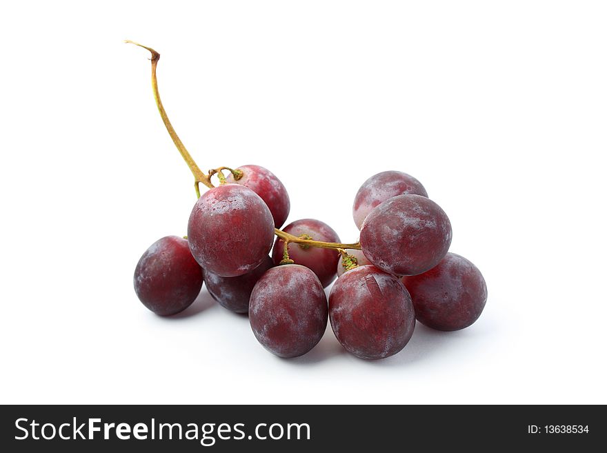A string of grapes isolated on white background. A string of grapes isolated on white background.