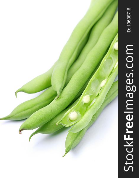 Pile of green french beans in isolated white background.