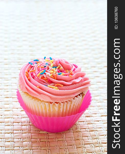 Vanilla Cupcake With Strawberry Icing