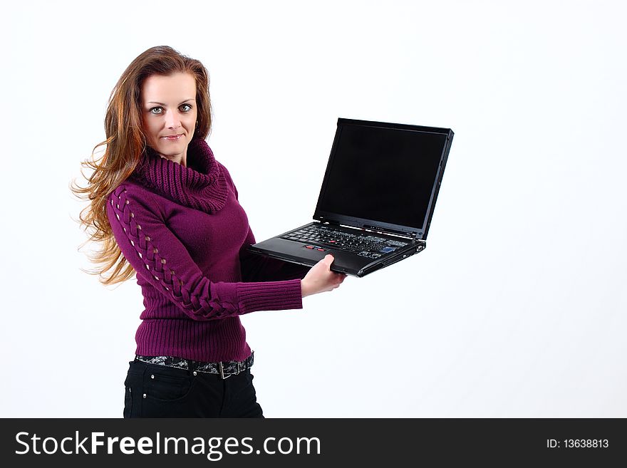 Attractive woman shows her Notebook on white background