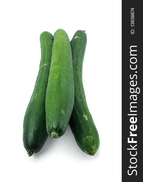 Close up of three cucumbers isolated over white background.