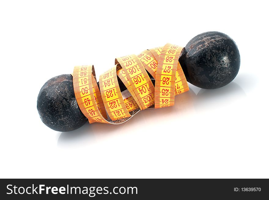 Dumbbell and tape-line on  white background. Fitness concept. Dumbbell and tape-line on  white background. Fitness concept.