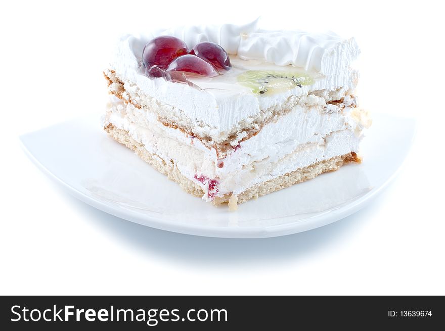 Tasty cake with fruit on plate