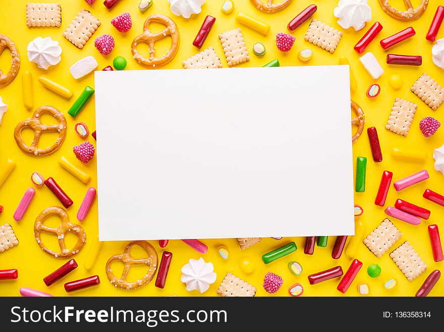 Flat Lay of Tasty Colorful Sweets on Yellow Background. Party Happy Birthday Concept. Copy space. Flat Lay of Tasty Colorful Sweets on Yellow Background. Party Happy Birthday Concept. Copy space