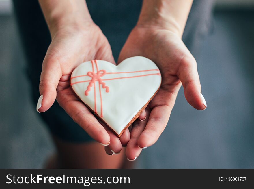 Heart White Glazed Gingerbread In Woman Hands, Valentine`s Day