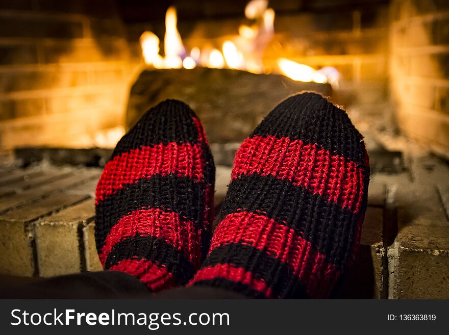 Warming Her Feet In A Fireplace