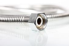Nut On A Metal Hose Stock Photography