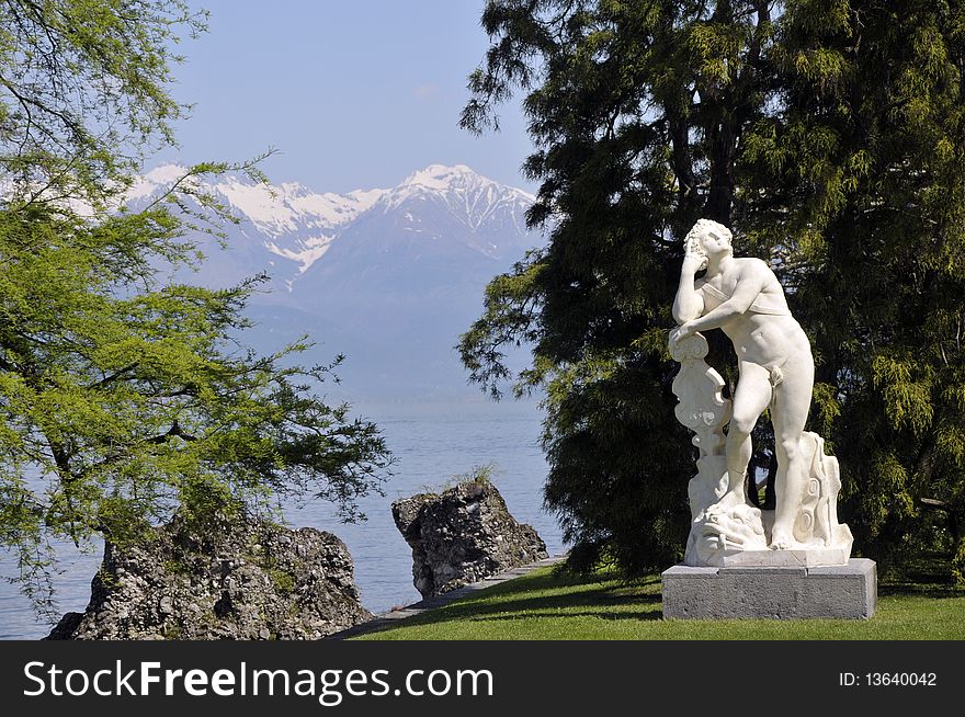 A statue in the gardens of Villa Melzi on the shore of Lake Como. A statue in the gardens of Villa Melzi on the shore of Lake Como