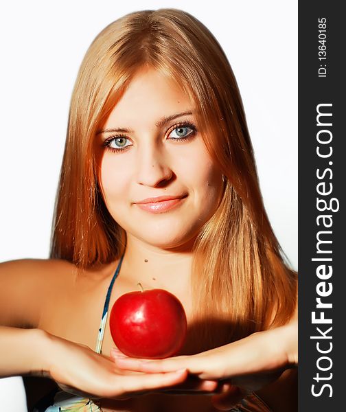 The girl with an apple on a white background