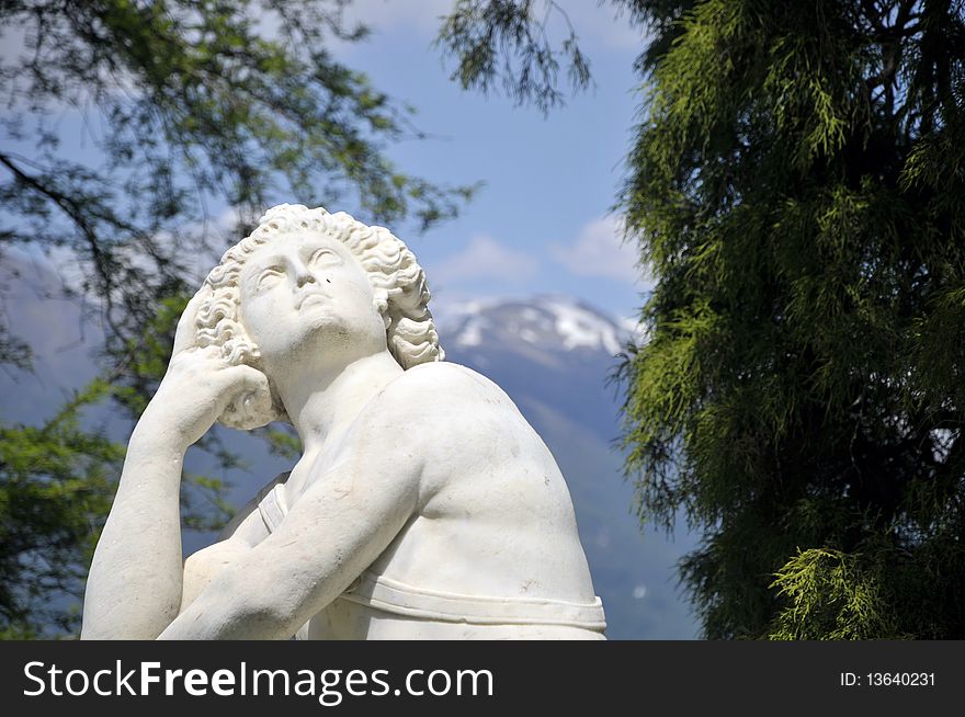 A statue in the gardens of Villa Melzi on the shore of Lake Como. A statue in the gardens of Villa Melzi on the shore of Lake Como