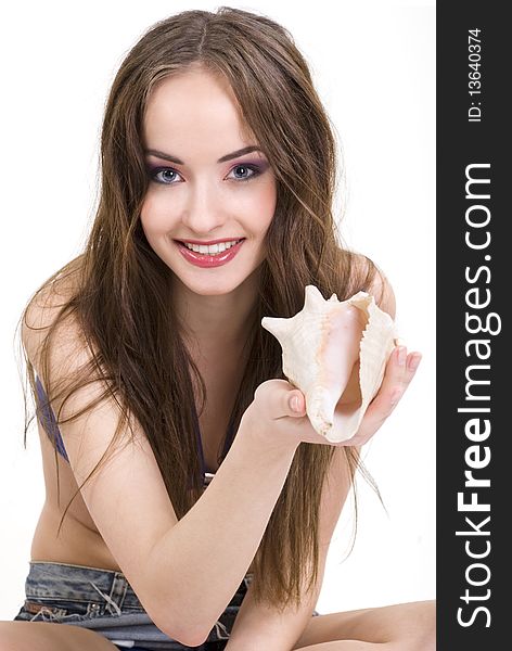 Studio portrait of a beautiful girl with seashells. Studio portrait of a beautiful girl with seashells