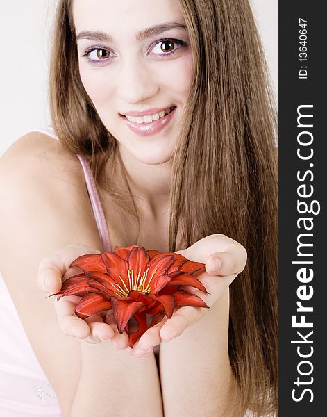 Studio portrait of a beautiful girl with flowers