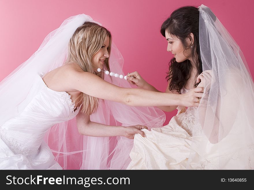 Two brides fight and shout at each other. Two brides fight and shout at each other