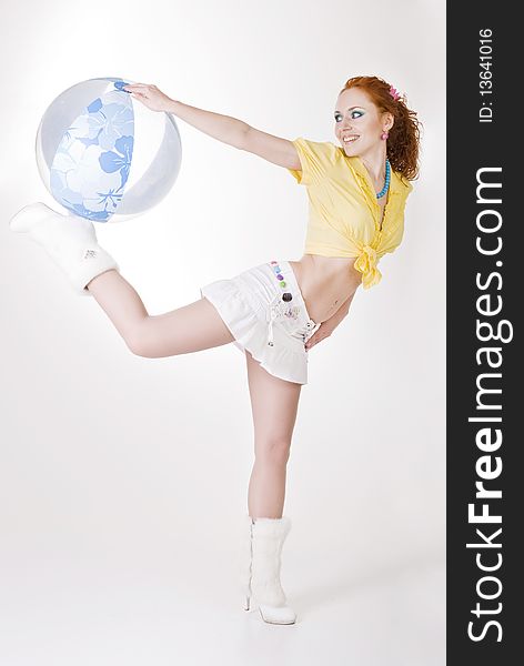 red-haired girl with bright make-up on a white studio background. red-haired girl with bright make-up on a white studio background