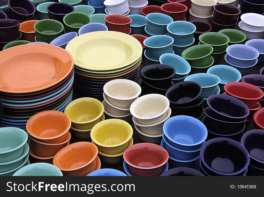 Stacks of colorful tableware create an interesting palette. Stacks of colorful tableware create an interesting palette
