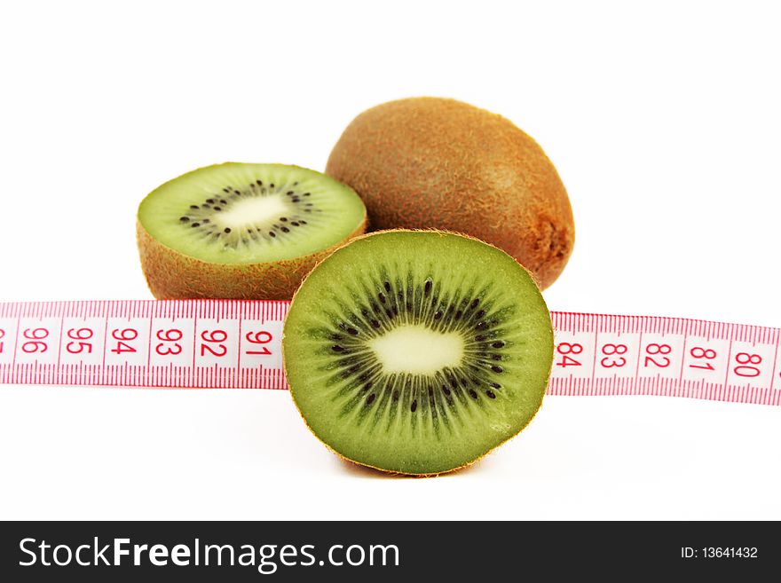 Juicy fresh kiwi fruit with tape measure isolated on white background. Juicy fresh kiwi fruit with tape measure isolated on white background