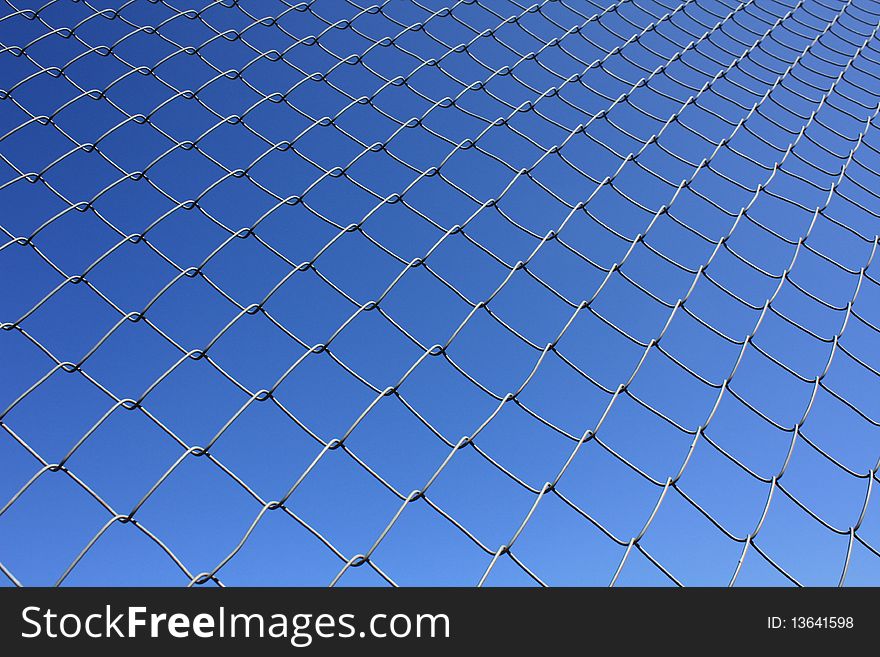 Isolated Rabitz wire netting in clear blue sky background