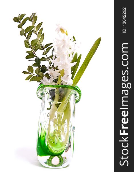 White flower in green vase isolated on white. White flower in green vase isolated on white