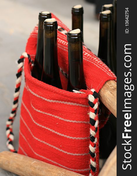 Wine bottles in traditional woven handbag