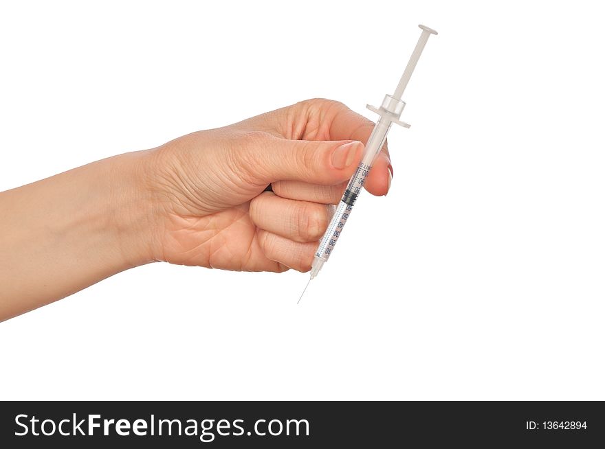 Syringe in the woman's hand for making injections