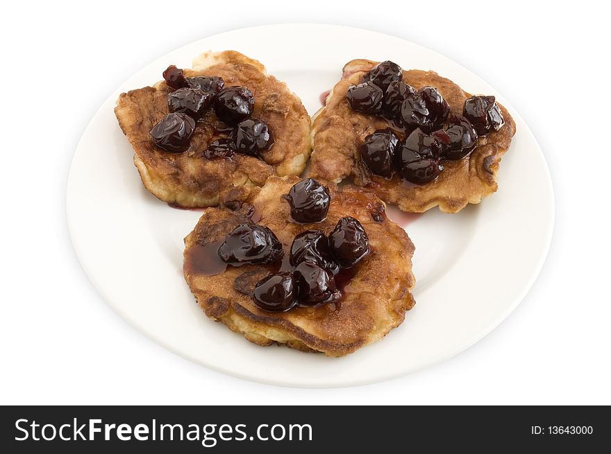 Pancakes with jam on a plate on a white background