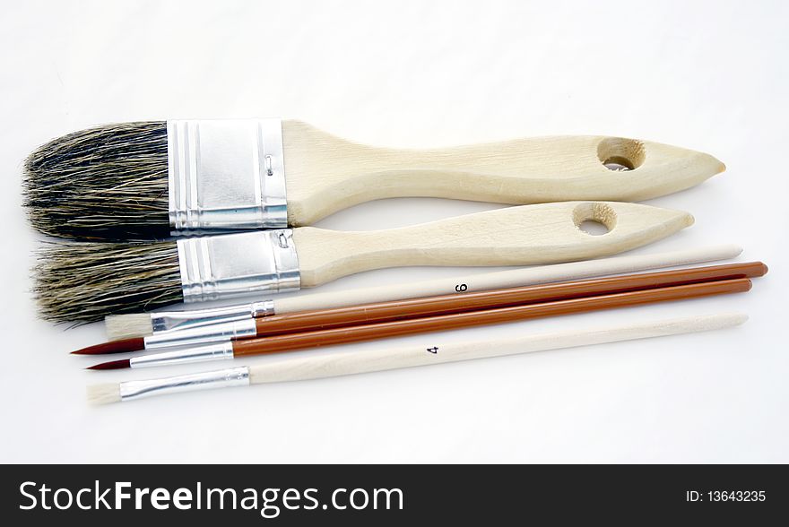 Brushes of different sizes on the white background