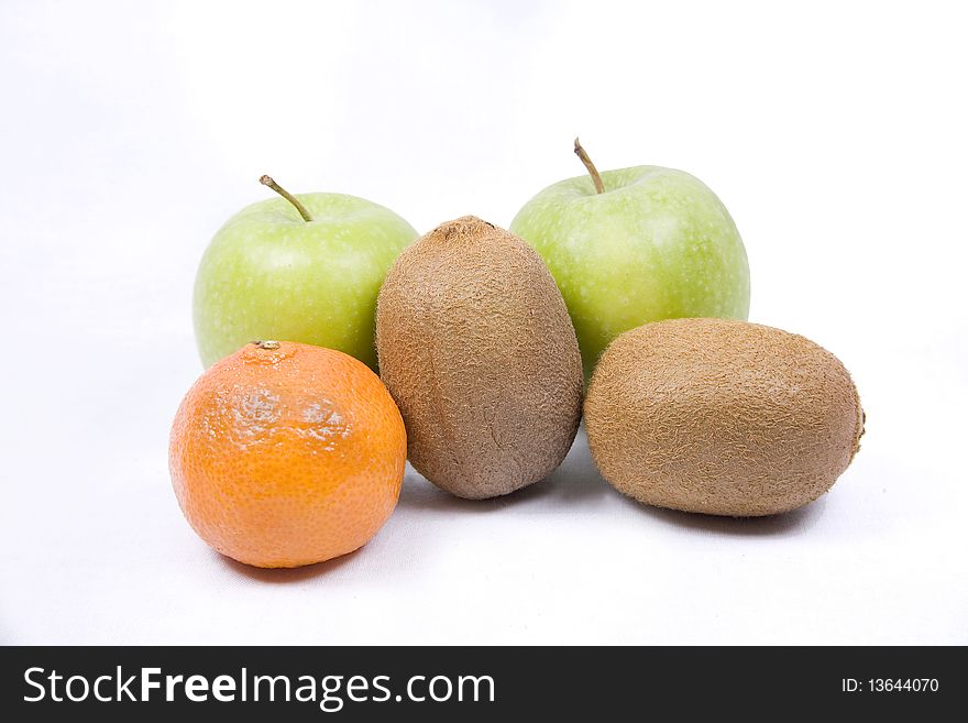 A selection of Apples, oranges and Kiwis isolated on a white background. A selection of Apples, oranges and Kiwis isolated on a white background.