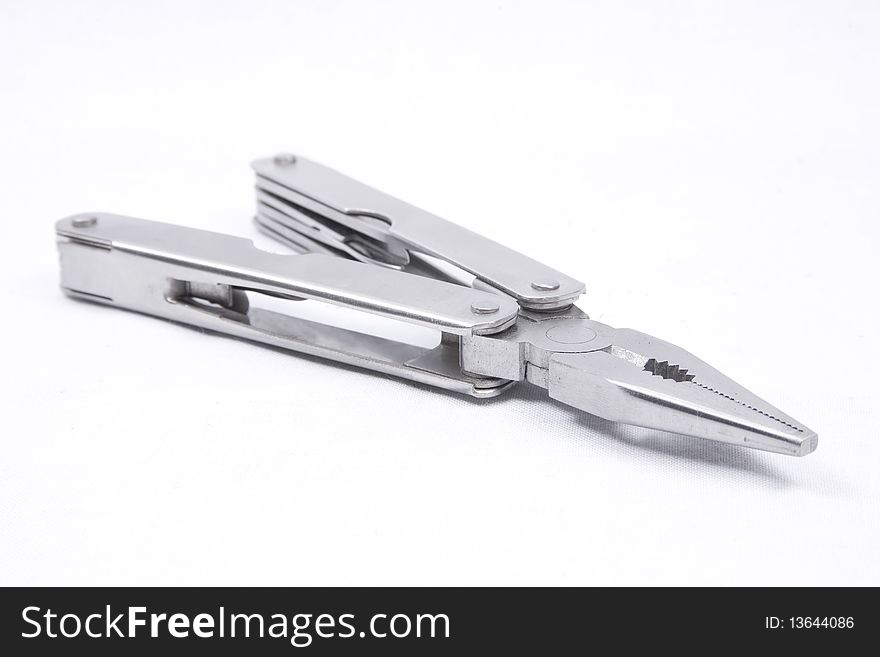 A multi-tool with pliers selected isolated on a white background. A multi-tool with pliers selected isolated on a white background.