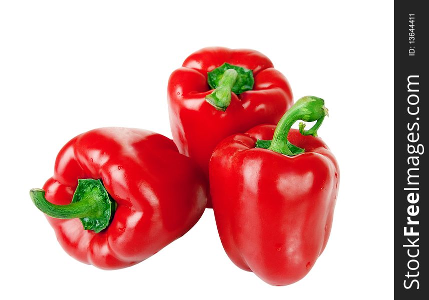 Three red peppers isolated on white background.