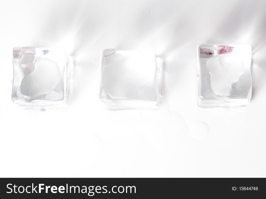 Translucent ice cube isolated over white background