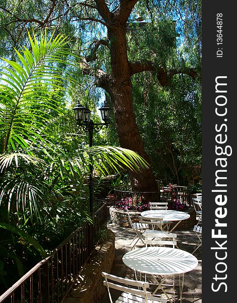 Exotic Garden in France, with tables and chairs. Exotic Garden in France, with tables and chairs