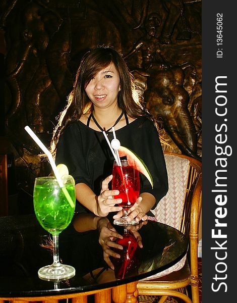 Woman cocktail drink red and green