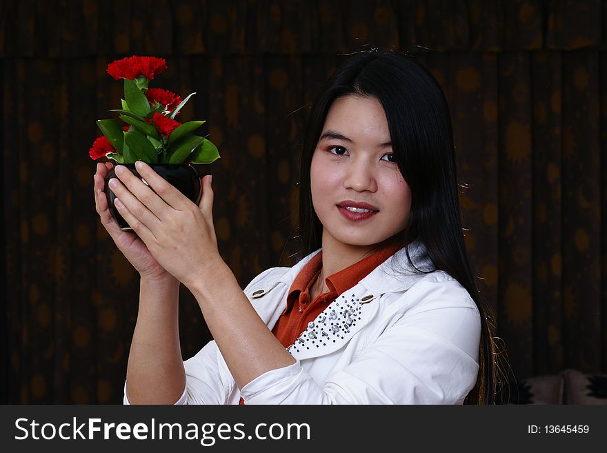 Hands holding red flesh flowers. Hands holding red flesh flowers