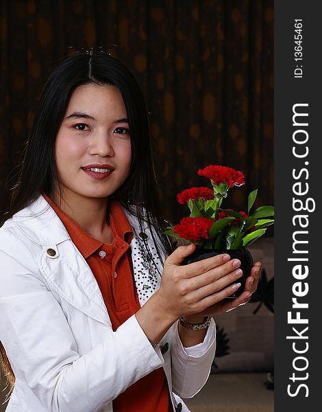Hands holding red flesh flowers. Hands holding red flesh flowers