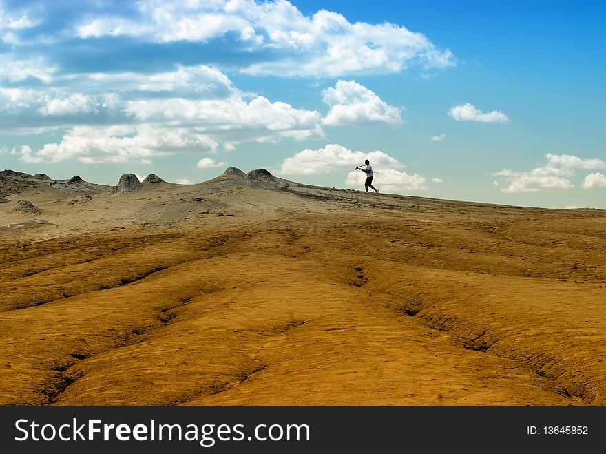 Photographer on arid landscape