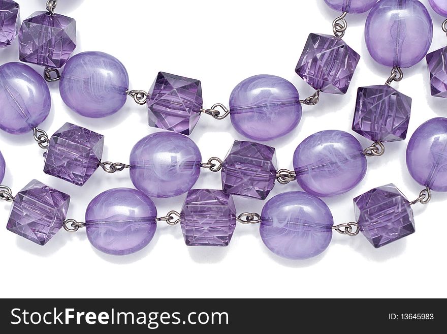 A chain  with purple jewels isolated on white. A chain  with purple jewels isolated on white