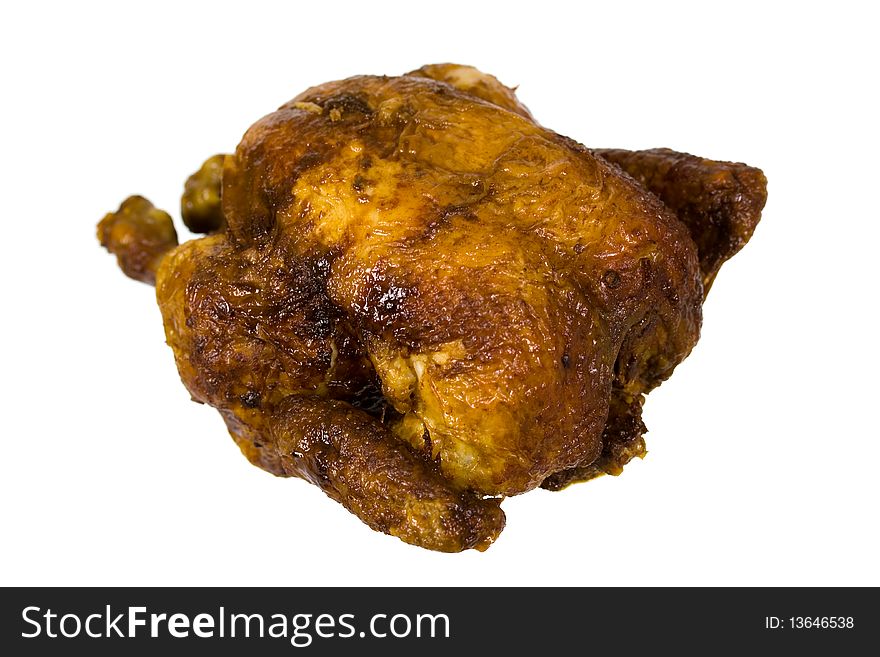 Golden roasted chicken on white plate isolated on