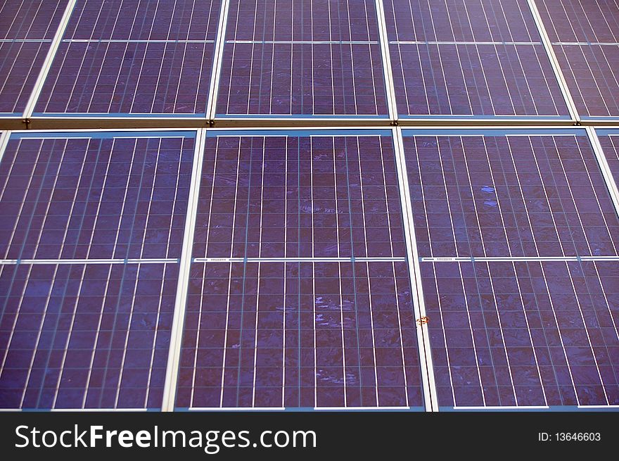 A group of blue solar panels in grid