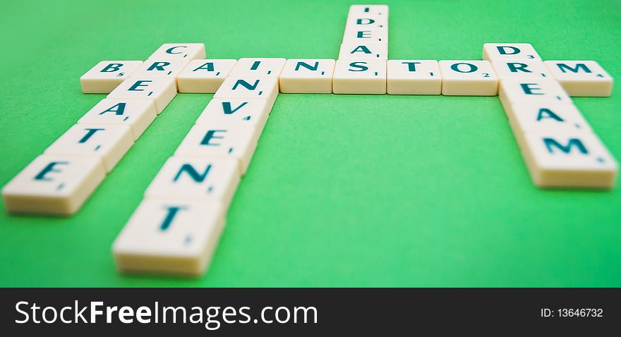 A scrabble game showing the words brainstorm, create, invent, ideas and dream.