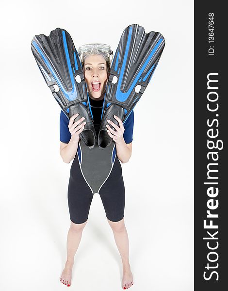 Standing young woman wearing neoprene with flippers and diving goggles. Standing young woman wearing neoprene with flippers and diving goggles