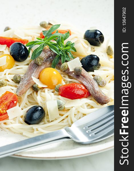 Pasta with anchovies, capers and olives