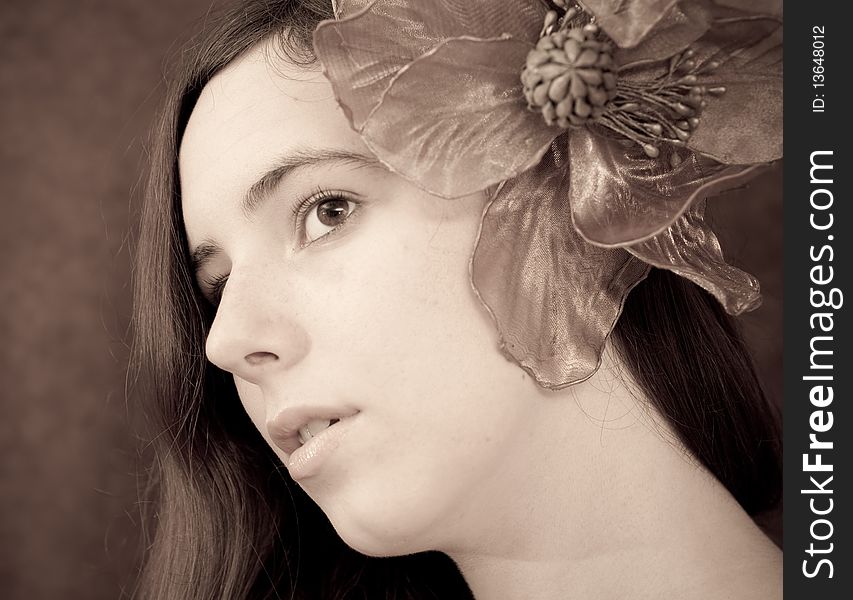 Portrait of a Girl with a Large Flower in Ear. Portrait of a Girl with a Large Flower in Ear