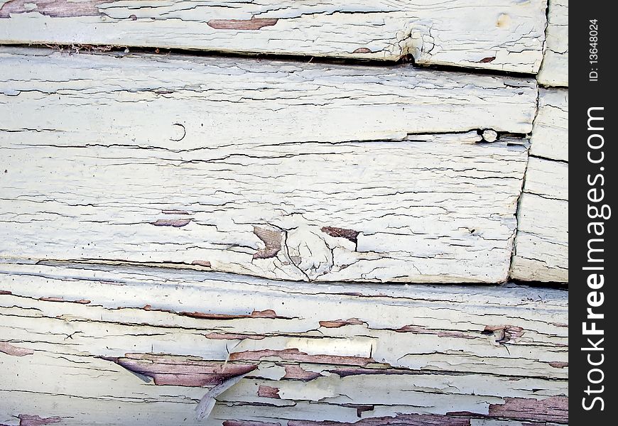 Closeup of old and worn white wooden wall.