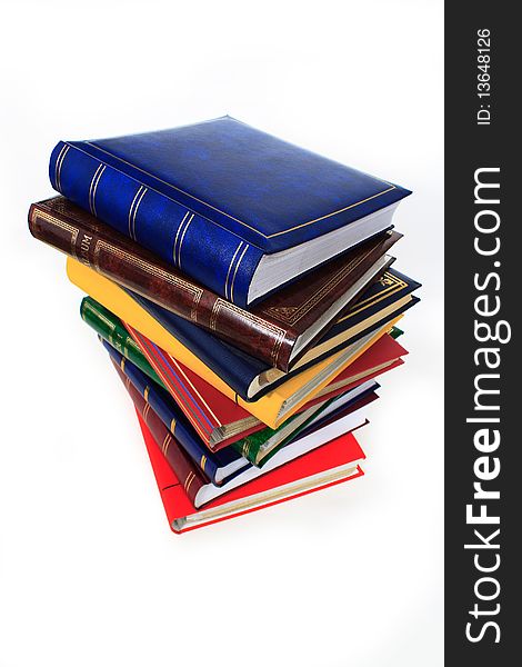 Pile of books in closeup on white background